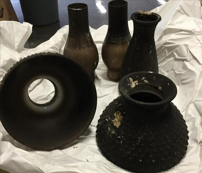smoke and soot covered glassware